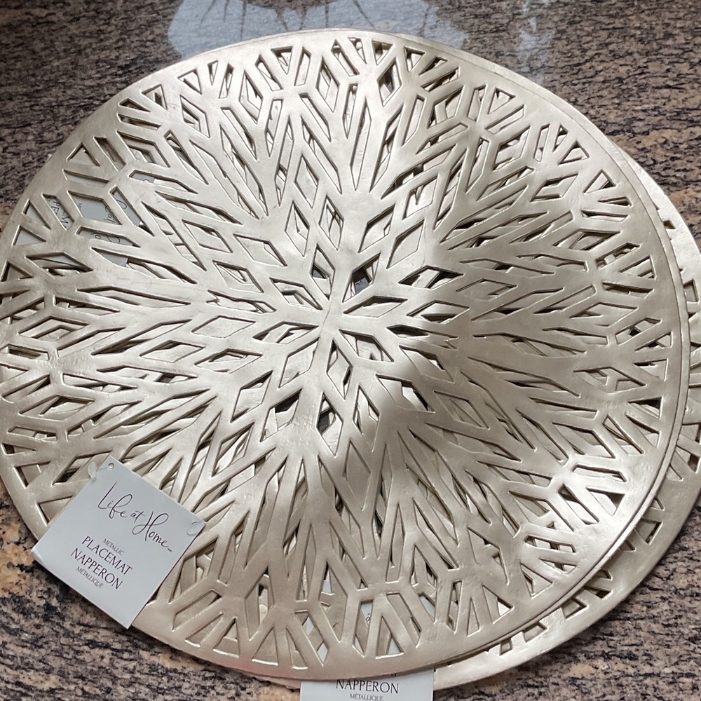 A lot of four, 15  inch metallic gold vinyl circle placemats.